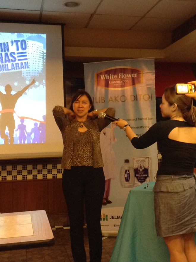 Ms. Jonie Sarmiento showing the proper way of using White Flower 